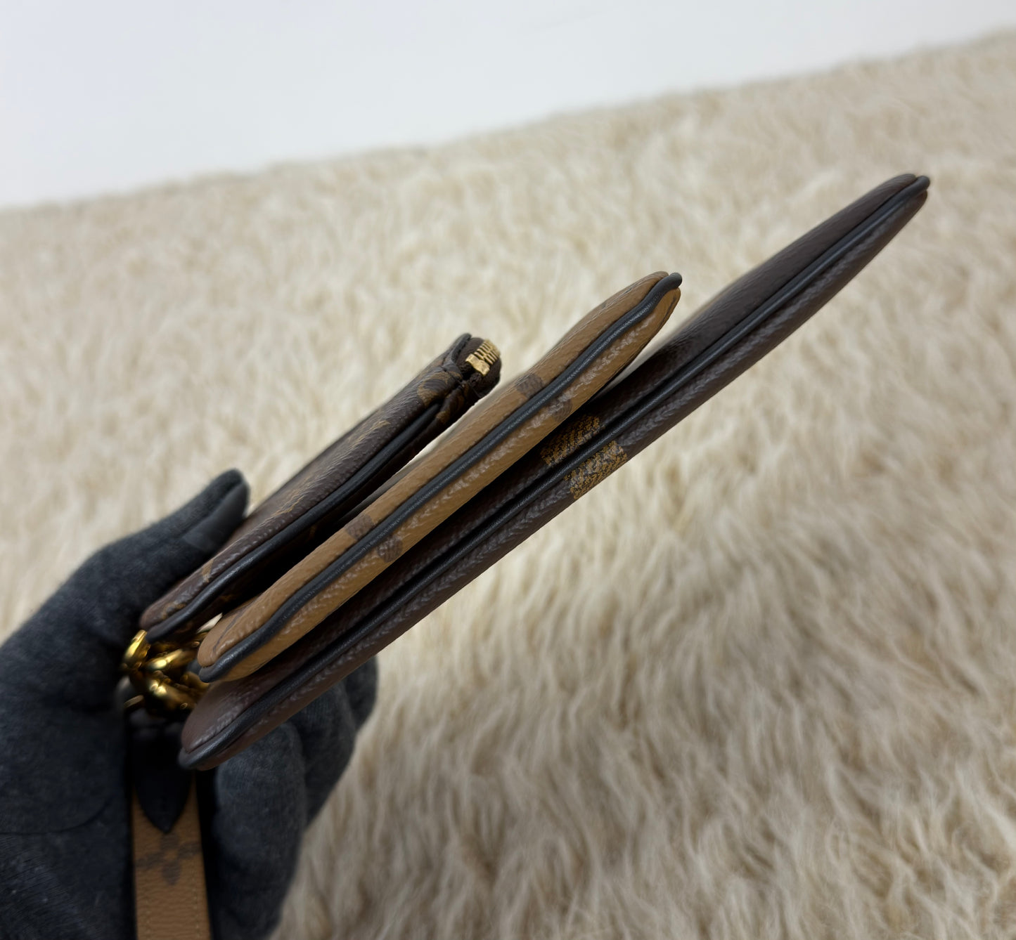 Louis Vuitton 
Monogram Giant Reverse Trio Pouch