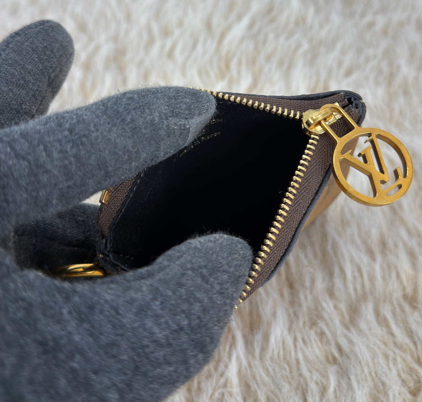 Louis Vuitton 
Monogram Giant Reverse Trio Pouch