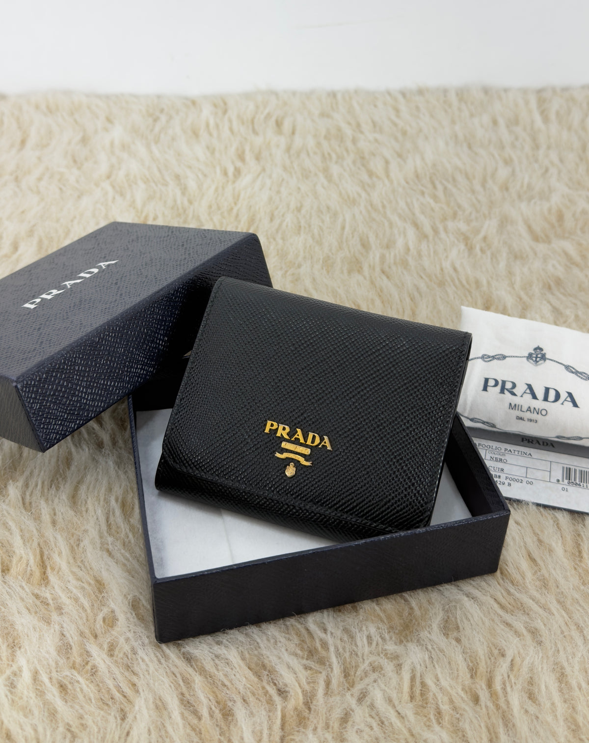 Prada Saffiano Leather Short Trifold
Clasp Wallet 1MH176