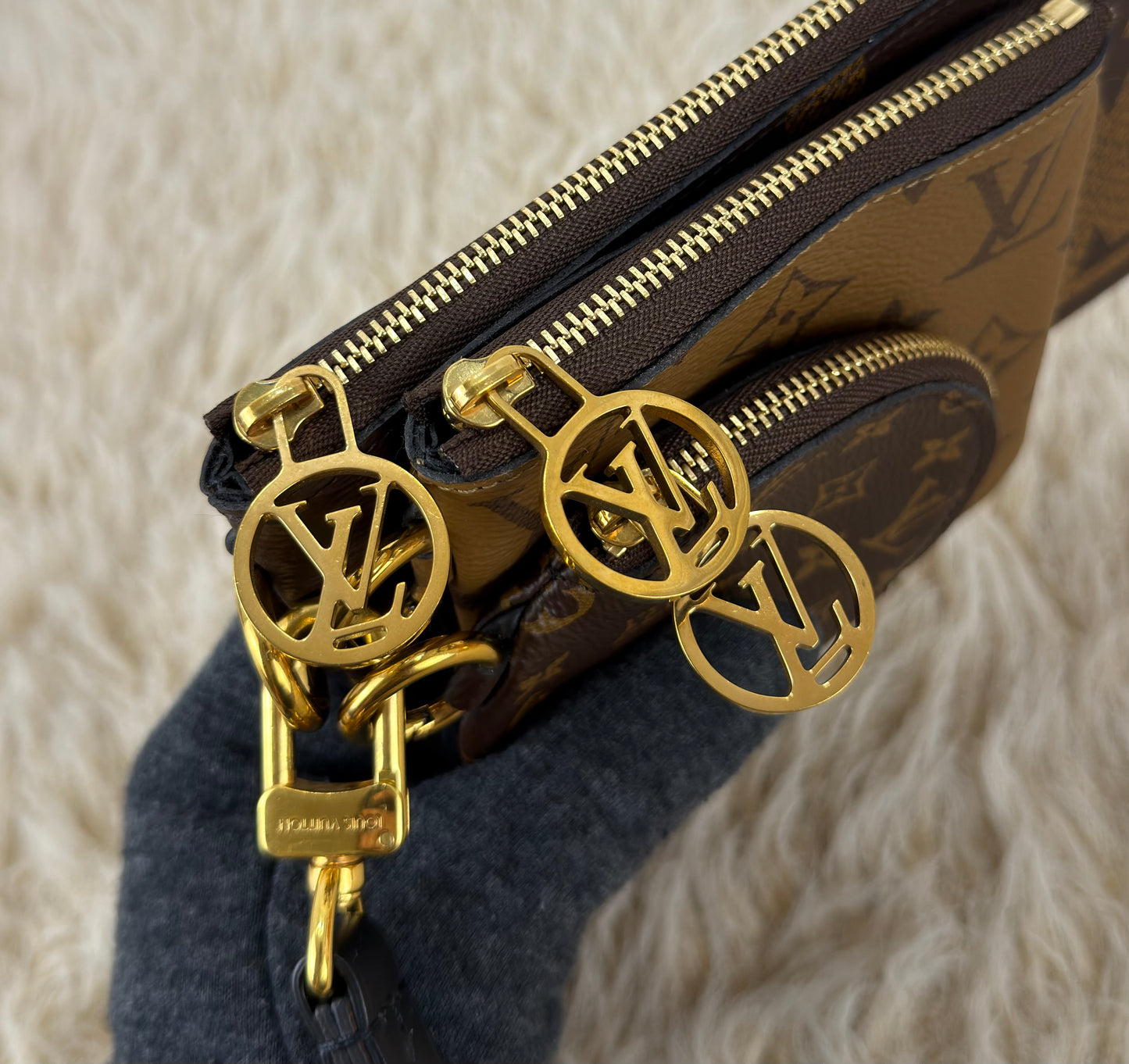 Louis Vuitton 
Monogram Giant Reverse Trio Pouch