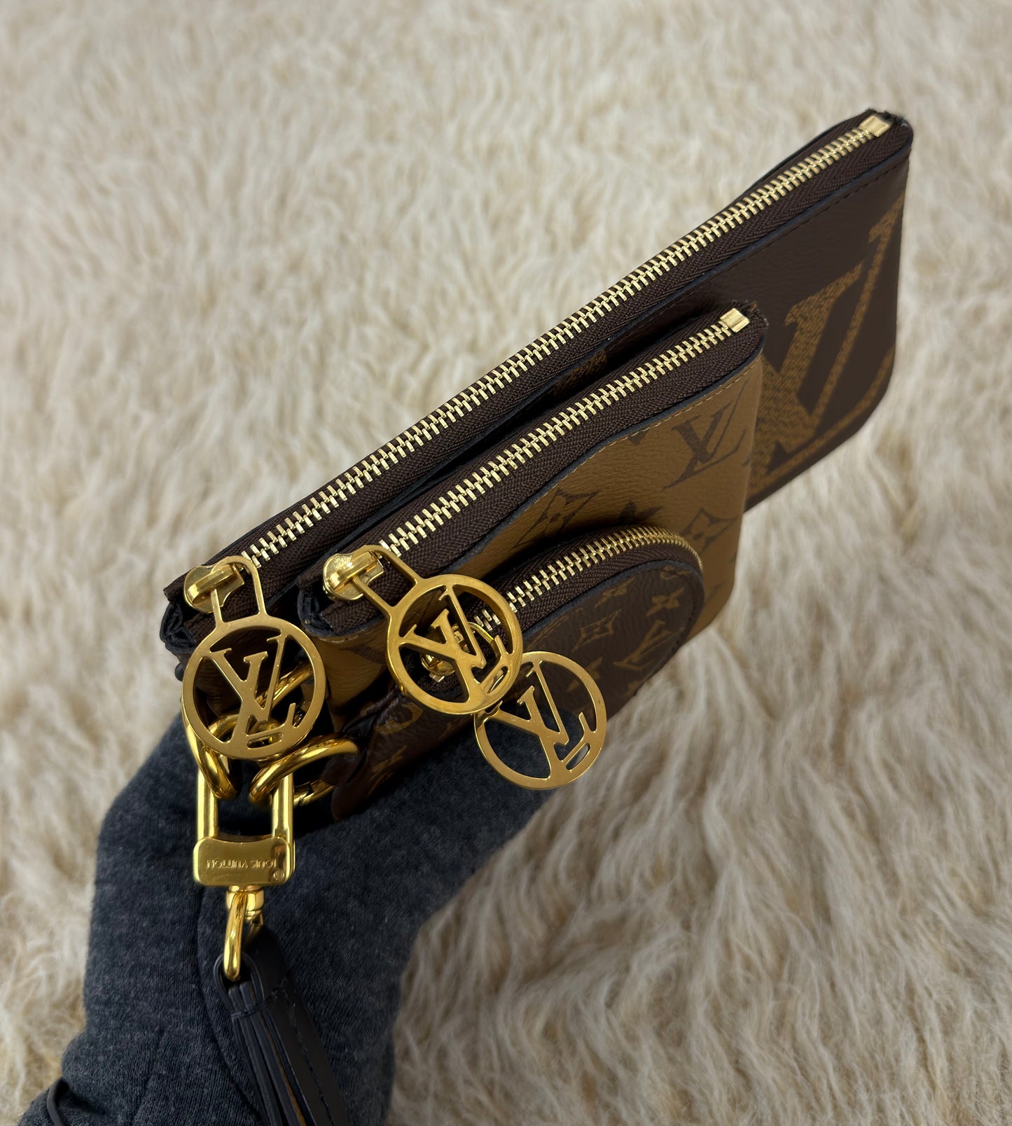 Louis Vuitton 
Monogram Giant Reverse Trio Pouch