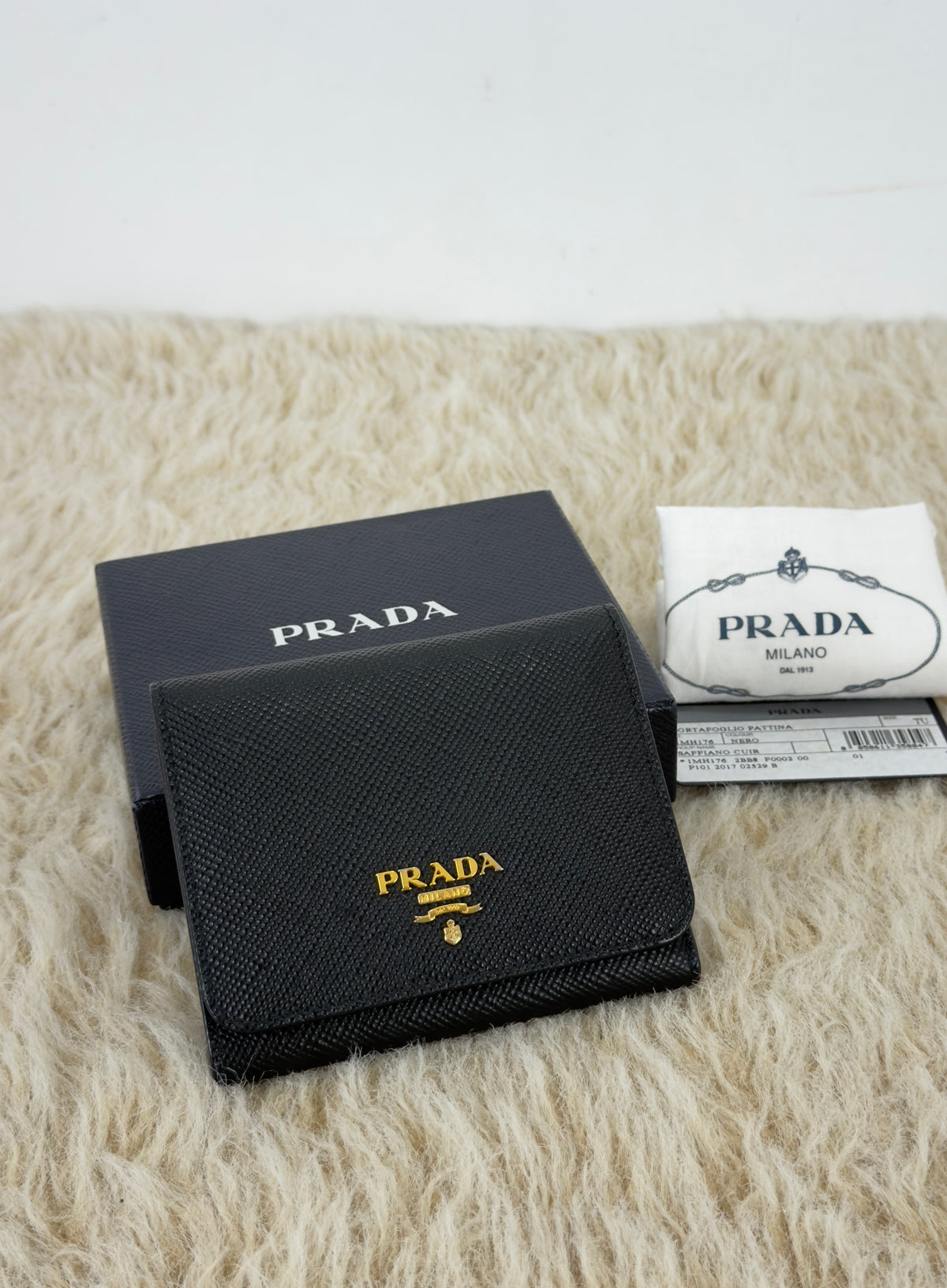 Prada Saffiano Leather Short Trifold
Clasp Wallet 1MH176