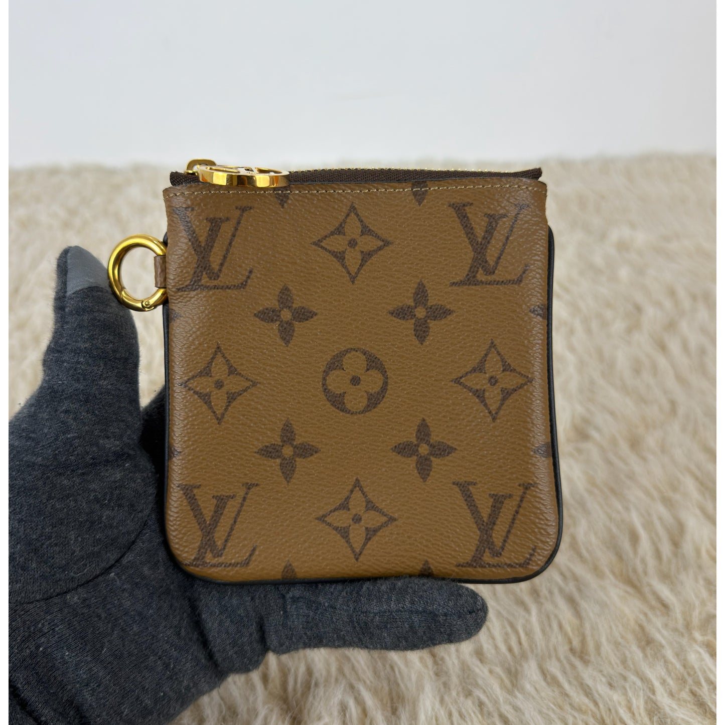 Louis Vuitton 
Monogram Giant Reverse Trio Pouch
