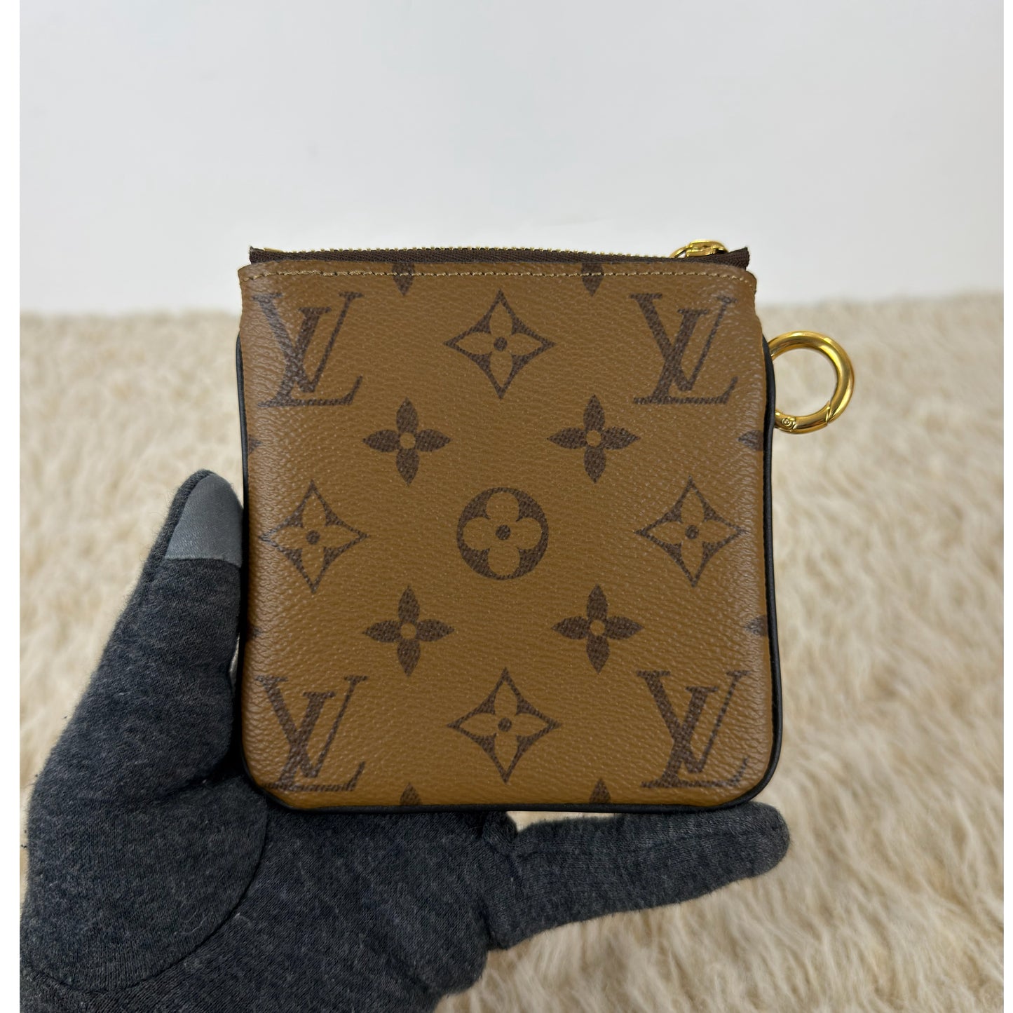 Louis Vuitton 
Monogram Giant Reverse Trio Pouch