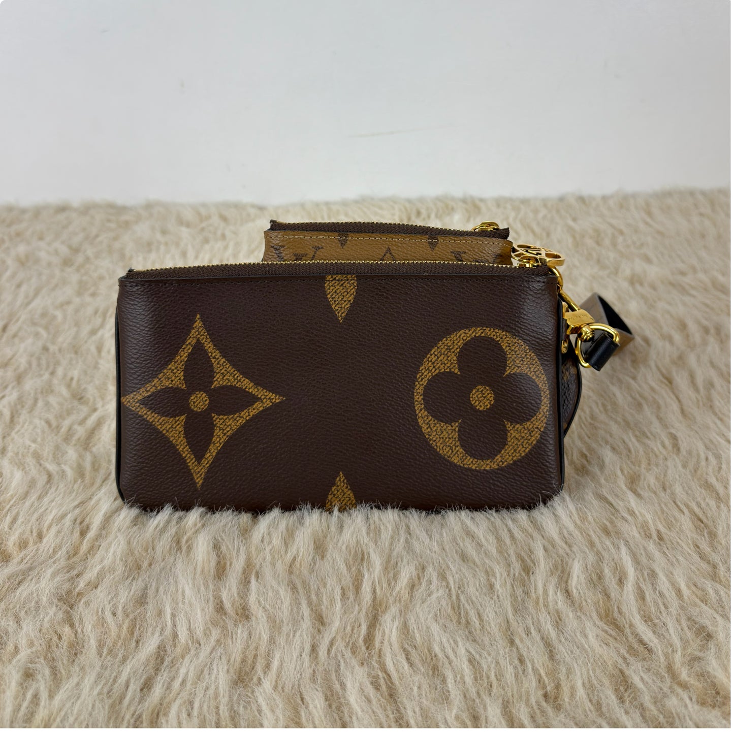 Louis Vuitton 
Monogram Giant Reverse Trio Pouch